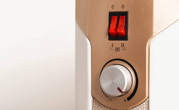istock Electric oil heater with adjustable air heating temperature. Copy space for text, heat irradiation 1742560347
