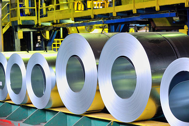 rolls of steel sheet rolls of steel sheet in a plant rolled up photos stock pictures, royalty-free photos & images