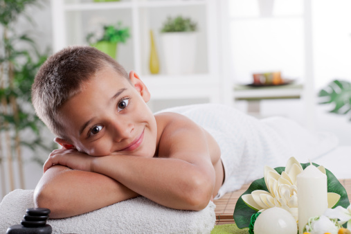 young smiling boy in spa salon
