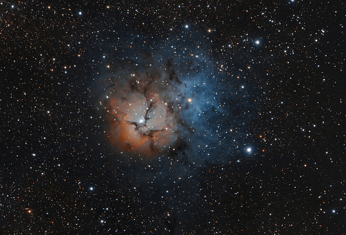 The Trifid Nebula is an H II region in the Sagittarius constellation in a star forming region in the Milky Way's Scutum Centaurus Arm. 5200 light years from Earth.