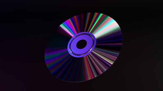 Abstract concept. The CD DVD spins on a black background. Rainbow. Blue neon color. 3d illustration.