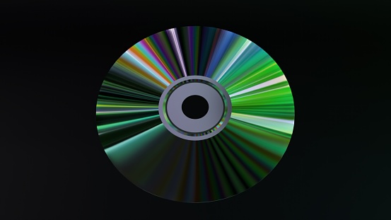 Abstract concept. CD DVD disc on a black isolated background. Neon blue purple color. Rainbow. 3d illustration.