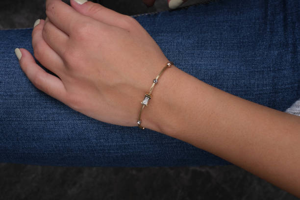 istock Gold bracelet in the woman's hand, 1742599443