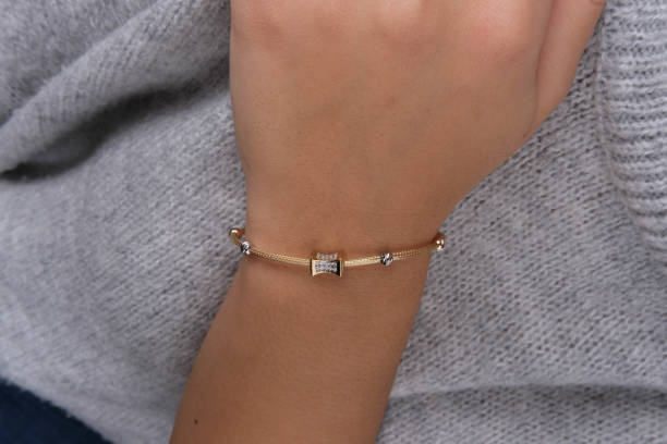 istock Gold bracelet in the woman's hand, 1742599451