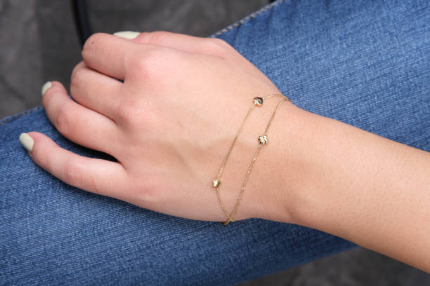 istock Gold bracelet in the woman's hand, 1742599470
