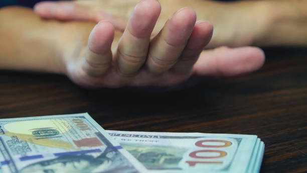 istock A man handing refuse  money benefits. benefit refuse consetp. 1742610667