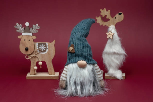istock Elf in grey hat with two reindeer. Christmas style. 1742612667