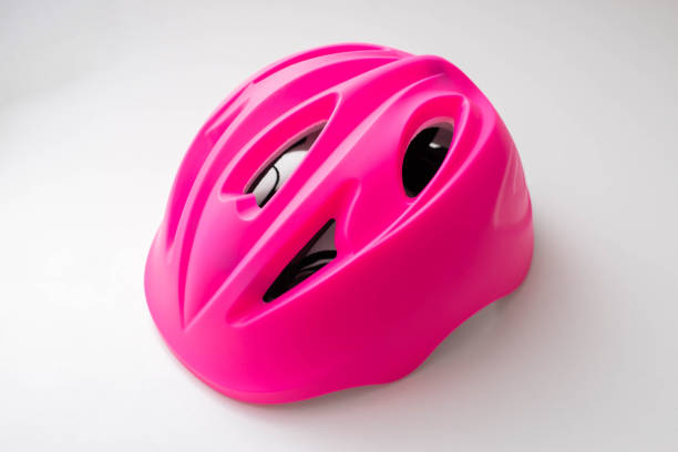 istock Pink children's protective helmet on a white background, close-up. 1742612898