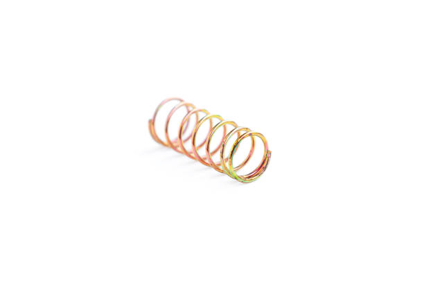 istock Golden helical coil spring isolated on white background, Old coil spring 1742613104