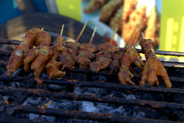 istock grilled chicken feet and smeared with red sauce 1742613422