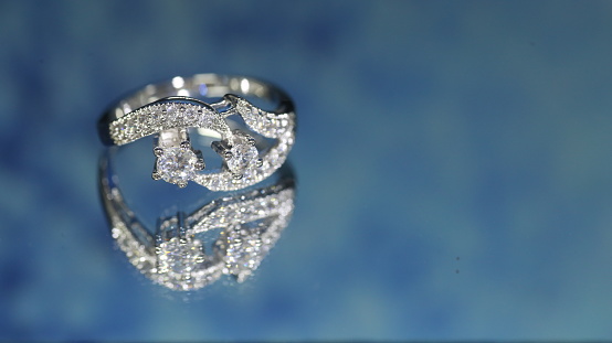 Diamond ring on dark blue background,wedding ring, engagement ring