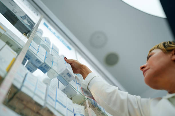 istock The Pharmacists examining shelves with medicines 1742614303