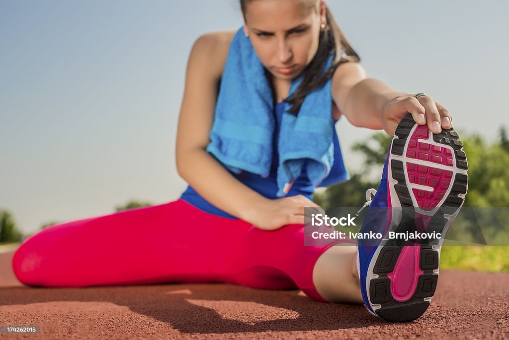 Atletica donna-spiagge - Foto stock royalty-free di Abbigliamento sportivo