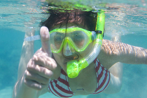 Woman snorkeling stock photo
