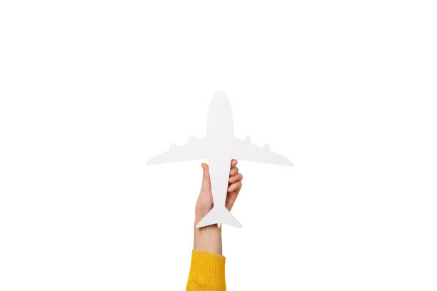 istock hand holding white airplane isolated on white background 1742661323