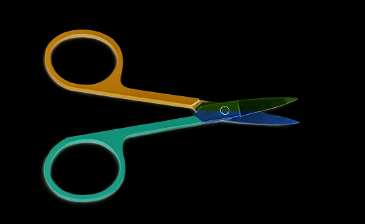 two color nail scissors on a black background