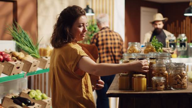 istock Woman using paper bag in bio store 1742667093
