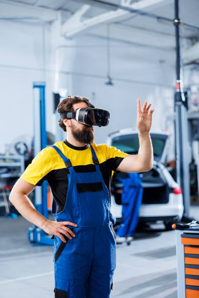 istock Repairman fixes car parts with VR 1742675971
