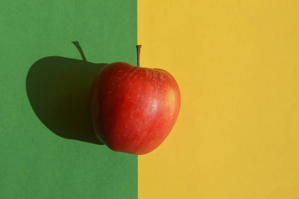 istock ripe red apple on a green background. back to school. delicious fruit. 1742677991