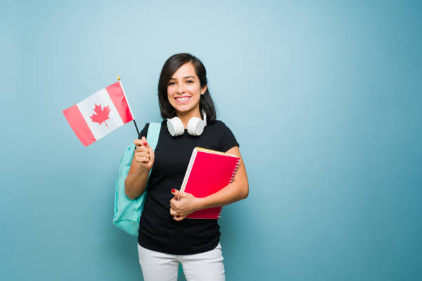 istock Beautiful woman holding the Canada flag learning English 1742686443