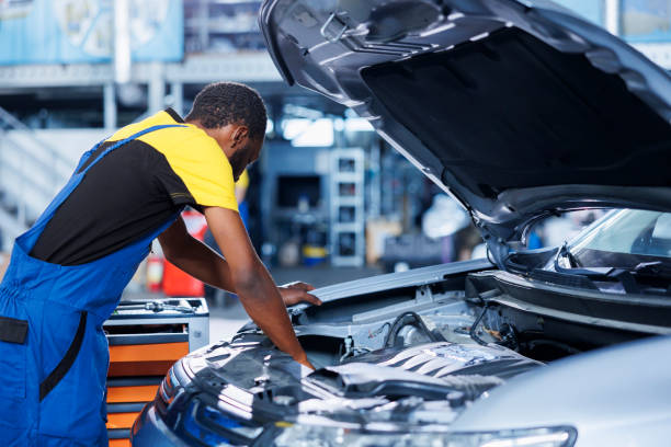 istock Specialist fixes car motor in garage 1742690056