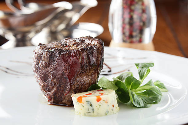istock peaces of meat with garnish 174269243