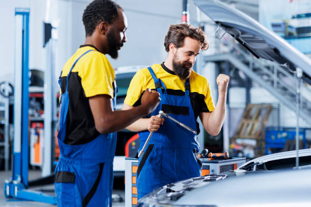 istock Repairmen happy after finding car issue 1742705180