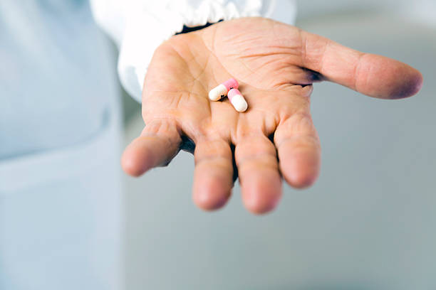 istock Doctor holding pills against anxiety 174270682