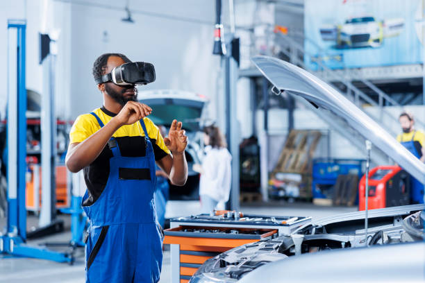 istock Professional repairs car with VR headset 1742706977
