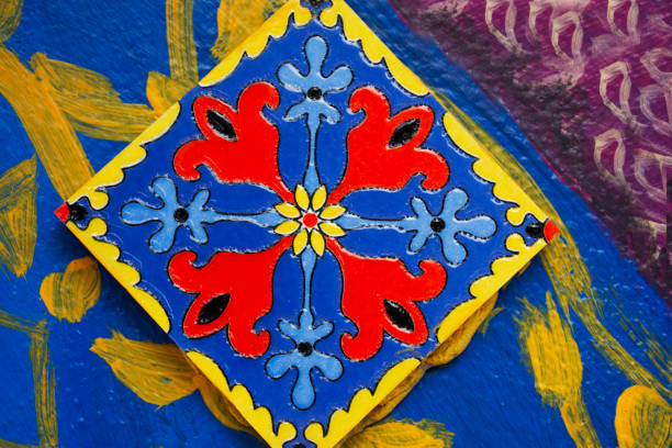 istock Handicraft retro tracery design ceramic and craft vintage marble tiles patterns on wall with graffiti street art in antique market 100 year arch bridge at Suratthani old town in Surat Thani, Thailand 1742708308