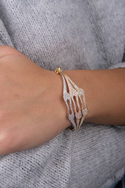 istock gold bracelet in woman's hand 1742723983