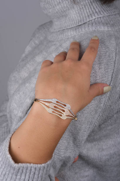 istock gold bracelet in woman's hand 1742723993