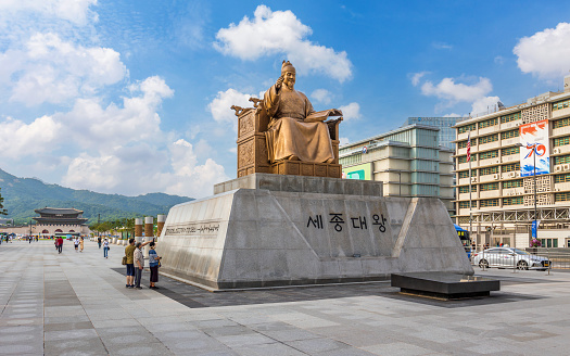 Seoul, South Korea : June 02 2023 : Statue of King Sejong the Great at Gwanghawmun Square is an Important landmark of South Korea in front of Gyeongbokgung Palace.