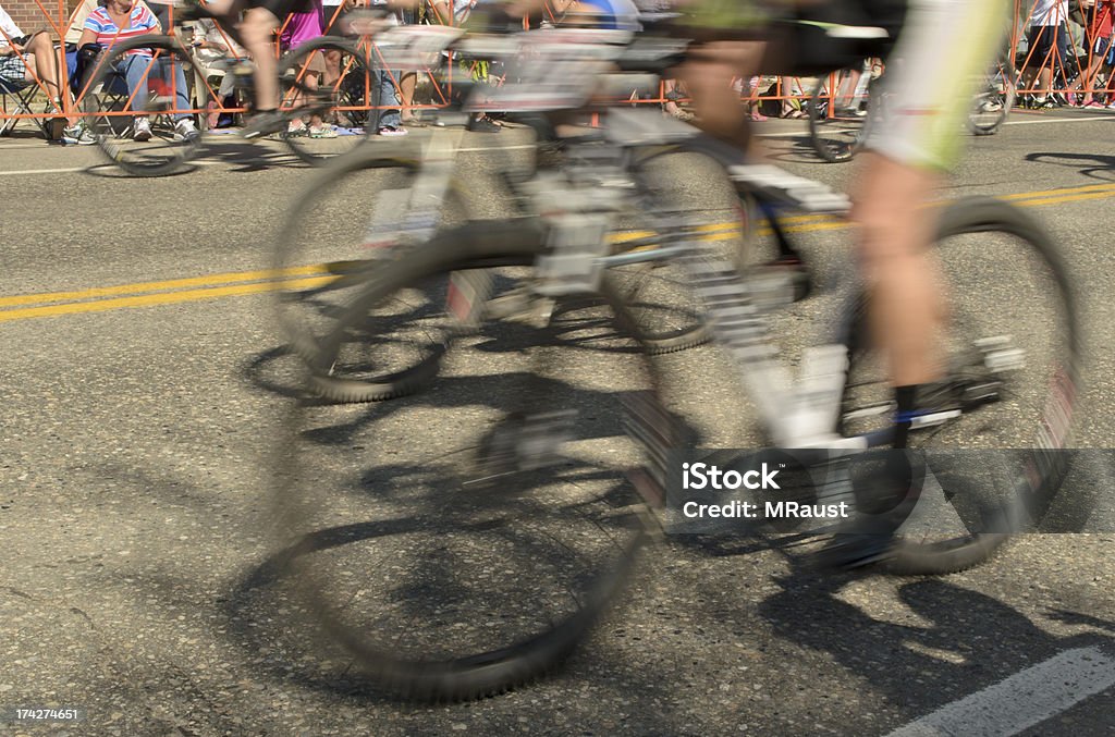 Moving bicycles racing for the Finish Line Racing road bicycles moving through town racing to the finish line Abstract Stock Photo