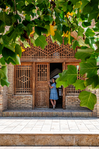 Tourist at the entrance of the Chris bazaar in Shahrisabz, beautiful building in typical style of Uzbekistan