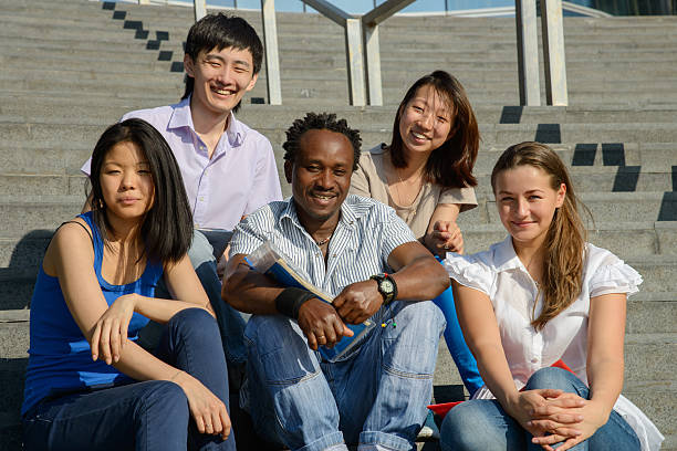istock Multiethnic group of university students sitting on steps 174277732