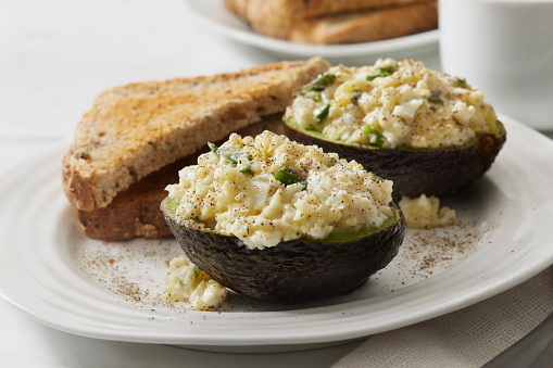 Avocado Egg Salad Boats with Green Onions and Whole Grain Toast