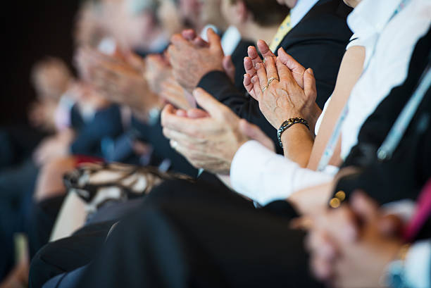 istock Applauding businesspeople in a row 174279906