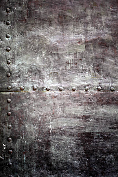 istock Black metal plate or armour texture with rivets 174280068