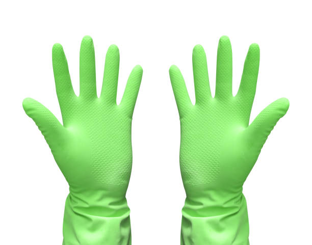 istock Green rubber gloves for cleaning isolated on black background. 1742802408