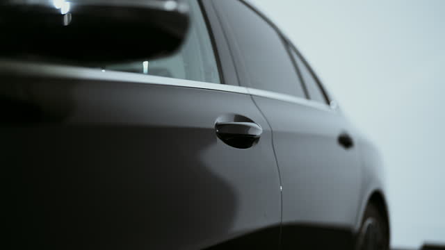 Camera pan shiny reflective surface of a brand new car doors