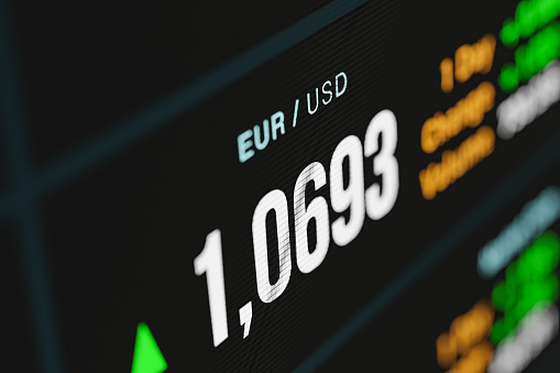 Euro - US dollar exchange rate. EUR rises against USD. Currency trading,  business, investment, stock market and exchange.