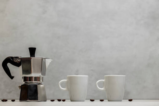 istock Metal geyser coffee maker on table with cup 1742813498