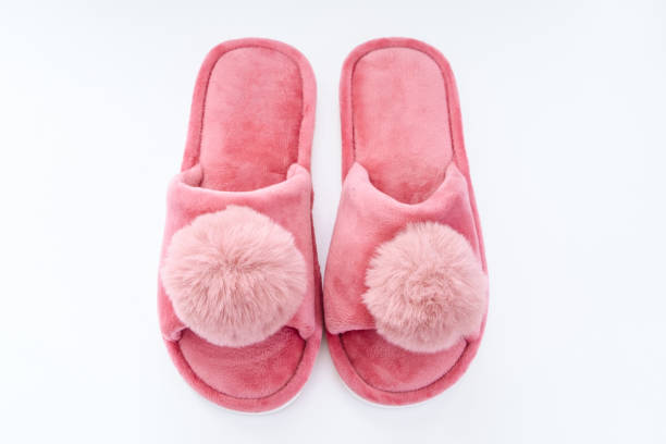 Cute home pink fluffy slippers on white background