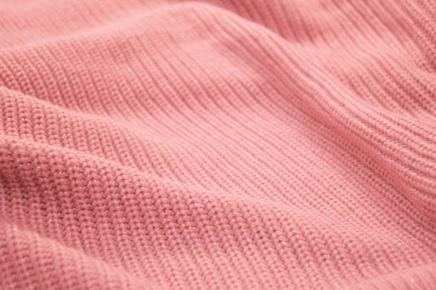 istock Texture of knitted wool pink coral fabric. Abstract background. 1742814600