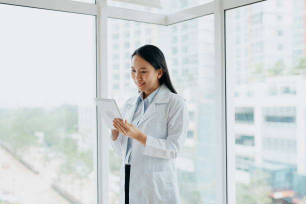 istock Female doctor using digital tablet in hospital 1742814661