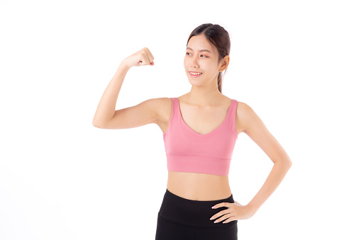 Portrait of beautiful young asian woman in sportswear showing strong muscles isolated on white background, sport and exercise for health, training and strength, female slimming with confident.