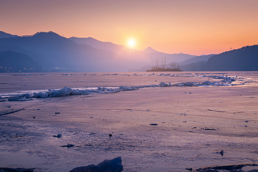 Frozen lake in South Korea in winter in sunrise at Dumulmeori, Yangpyeong, South Korea.
