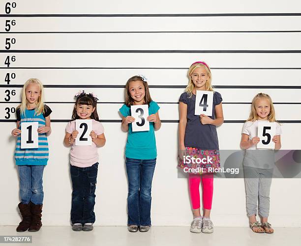 Police Lineup Of Five Little Girls Stock Photo - Download Image Now - Police Line-Up, Prison, Happiness