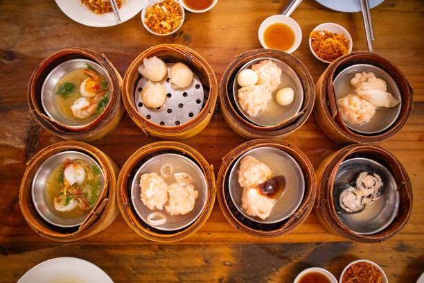 istock Family eating freshly steamed dim sum (Chinese food) 1742832361